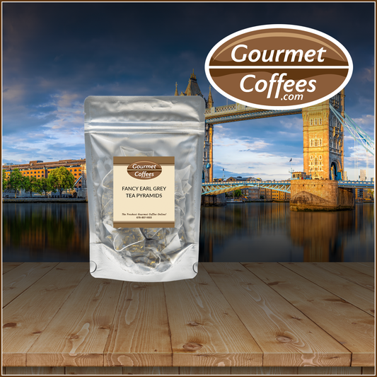Packaged tea pyramids with 'Gourmet Coffees' branding against a backdrop of Tower Bridge.