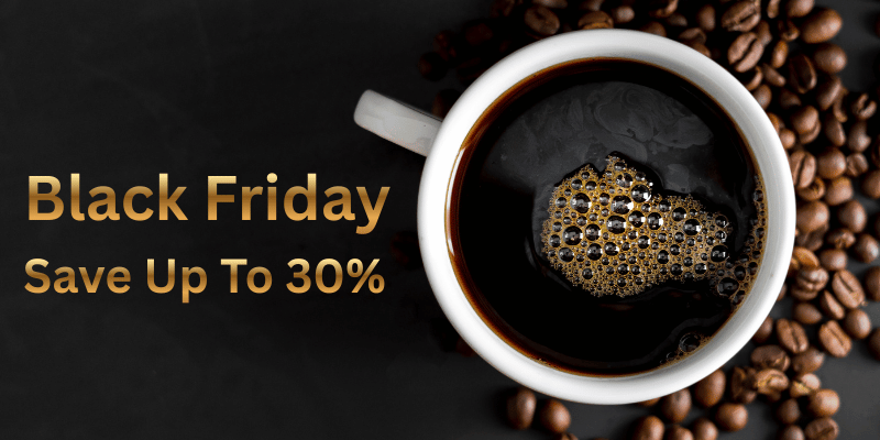 Promotional image for Black Friday with a cup of coffee and coffee beans on a dark background. Text reads save up to 30%.