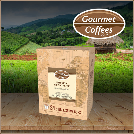 Gourmet Coffees package with a scenic background of green fields and mountains.