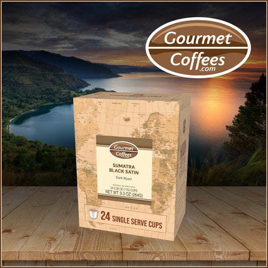 Box of Gourmet Coffees Sumatra Black Satin coffee on a wooden surface with a scenic background